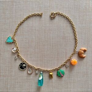 Very adorable charm necklace with gold chain